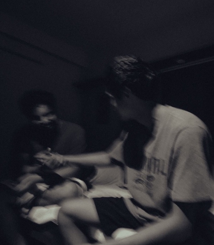 Friends talking in a dark room