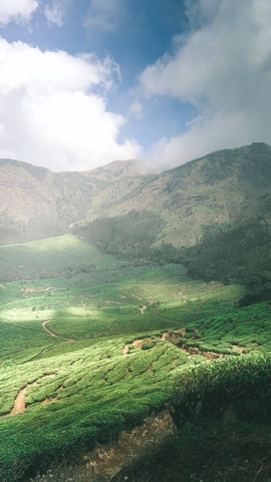 Green hills under a cloudy sky